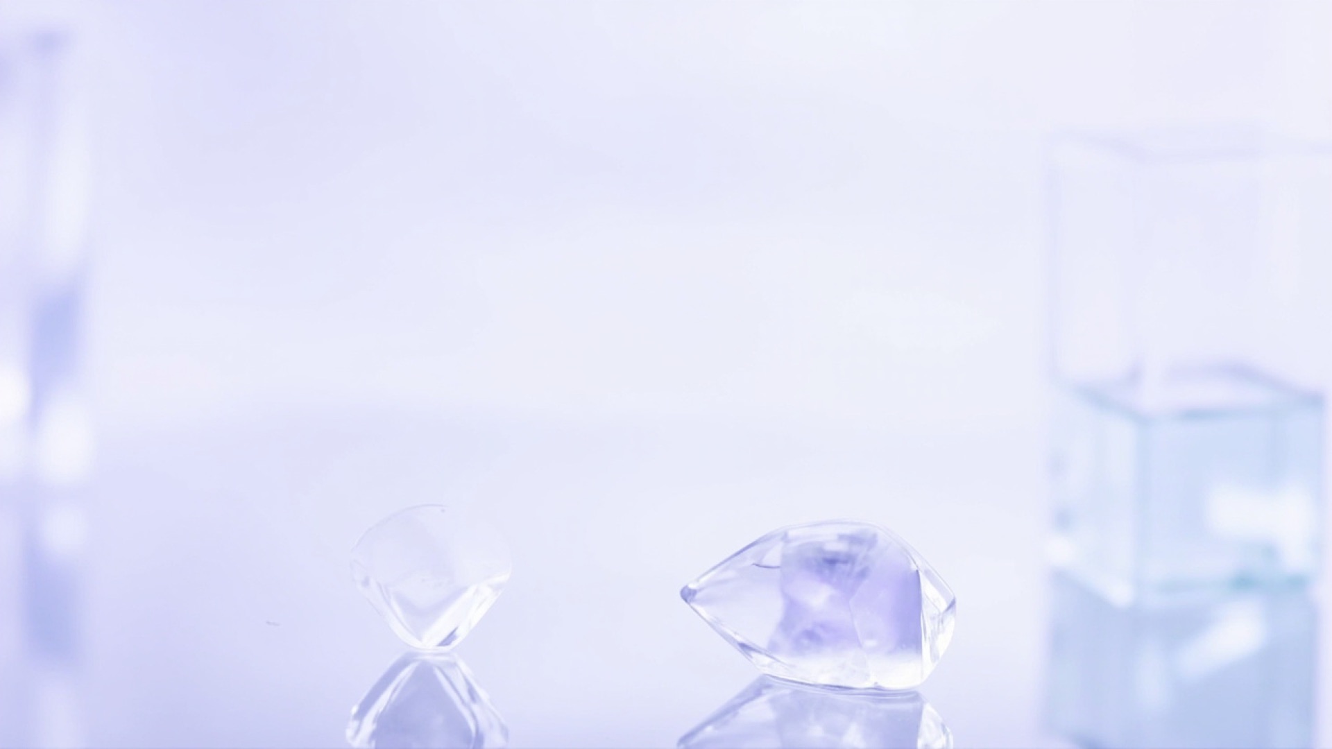 Glass prisms refracting soft purple and blue light