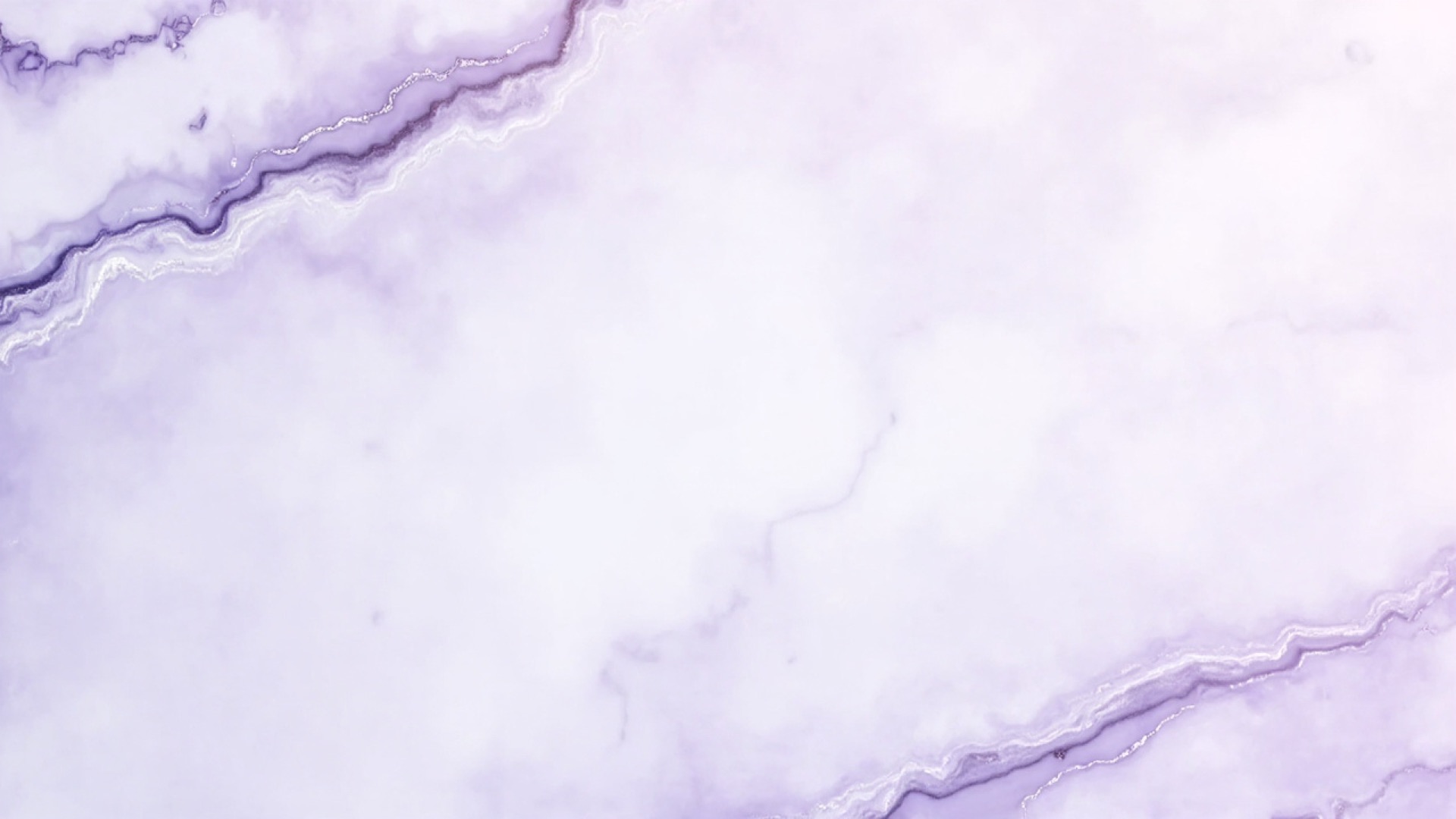 Polished onyx surface with subtle lavender veining