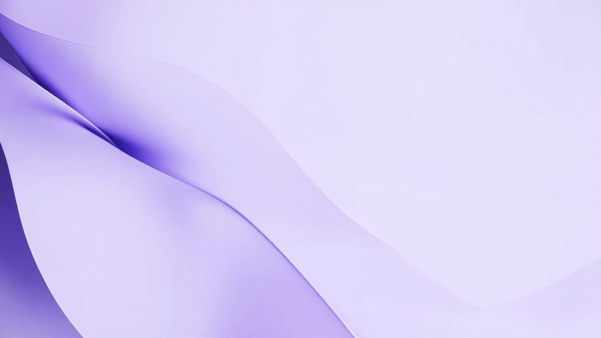 Soft folded paper in pale lavender, photographed in directional light